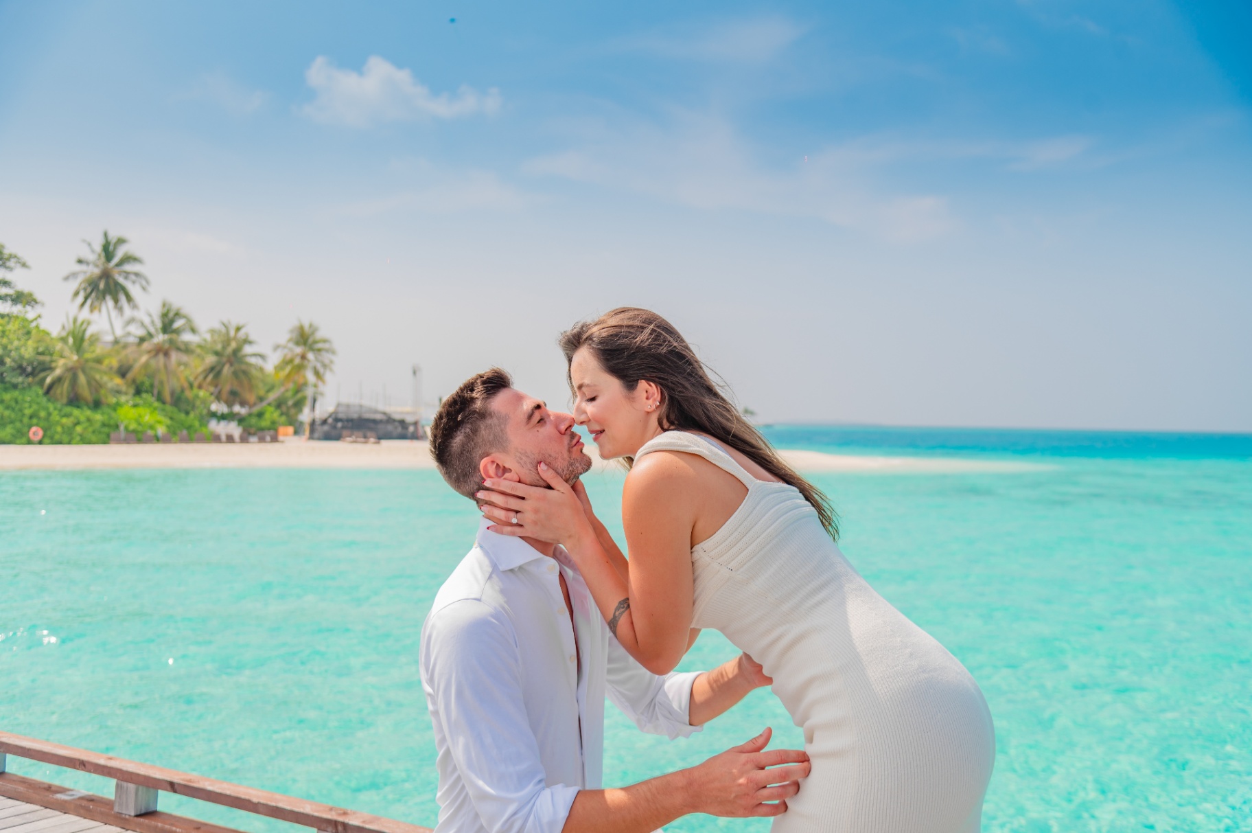 A kiss over turquoise water